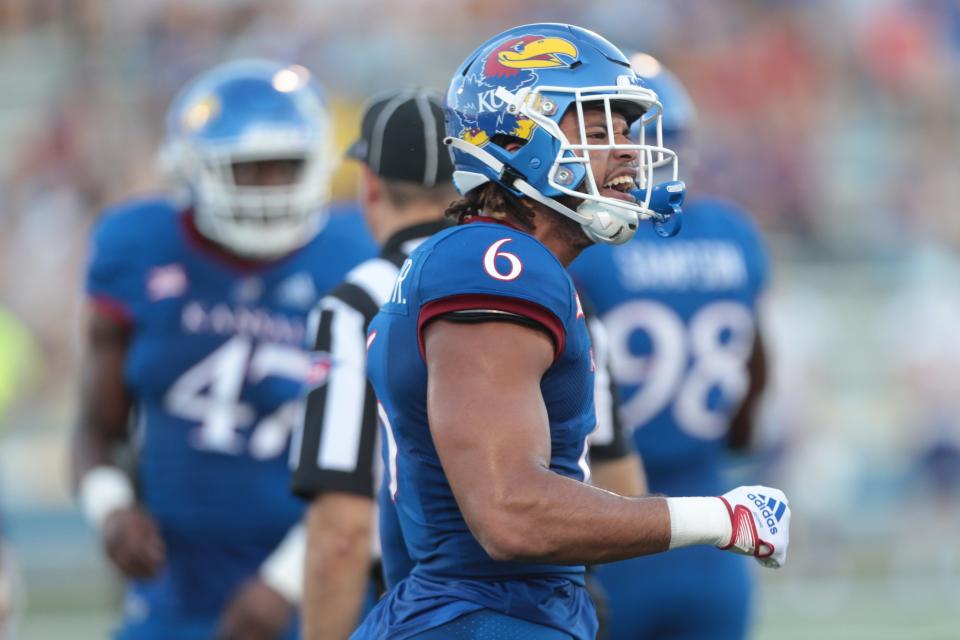 Kansas junior linebacker Taiwan Berryhill (6) yells out after the defense pushes Tennessee Tech back during the first half of a Sept. 2 game at David Booth Kansas Memorial Stadium in Lawrence.