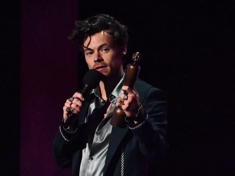 British singer Harry Styles celebrates after receiving the best pop and r&b act of the year award (AFP/Getty)