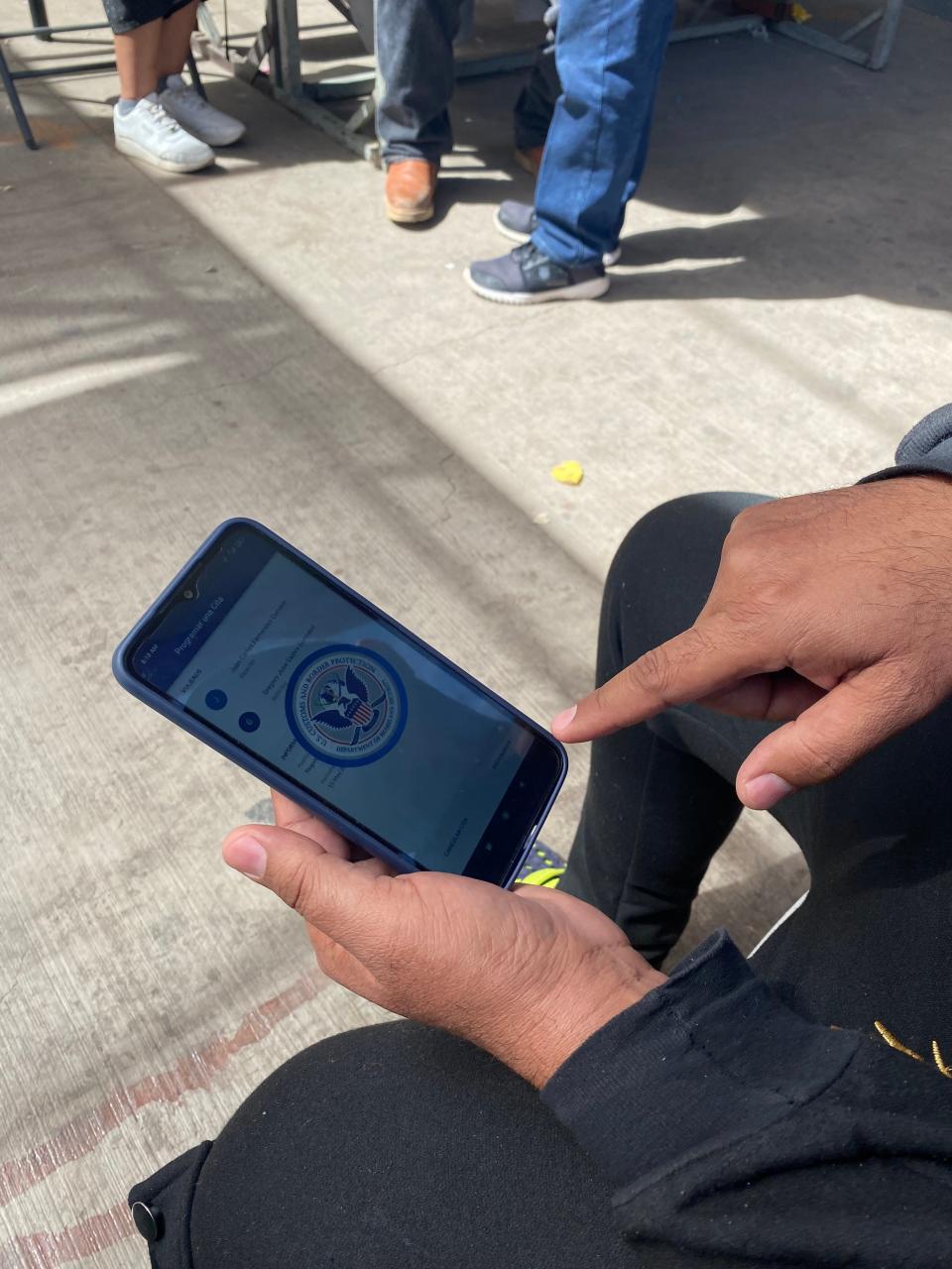 Juan Fernandez, a migrant from Venezuela, shows a screenshot of the error screen he received when he tried to book an appointment through the mobile government application, CBP One.