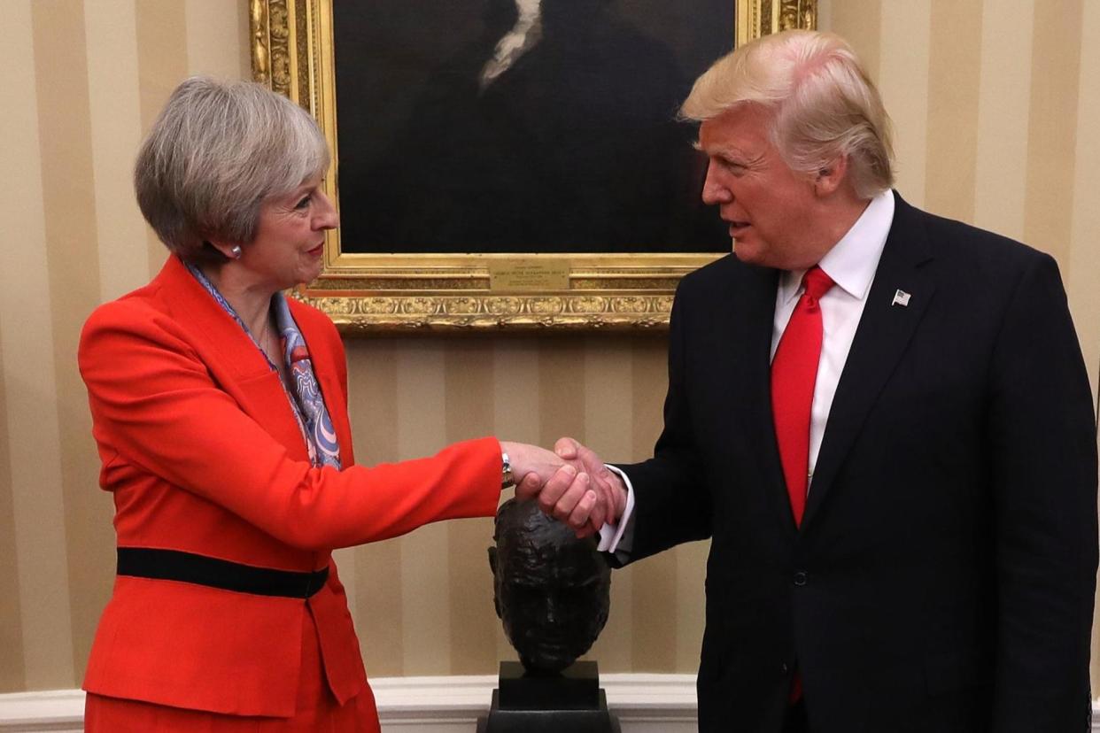 Theresa May meets Donald Trump at the White House in January last year: Getty Images