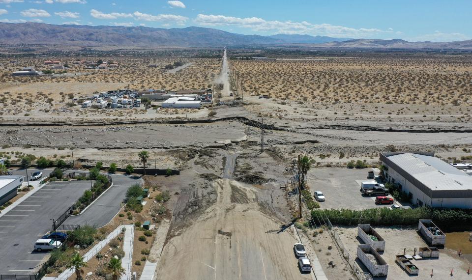 Dillon Rd. is closed at the wash as it is covered in mud and water from the rains from Tropical Storm Hilary in Desert Hot Springs, Calif., August 22, 2023.