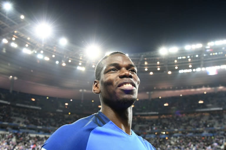 France's midfielder Paul Pogba celebrates at the end of the 2018 World Cup qualifying football match between France and Sweden on November 11, 2016