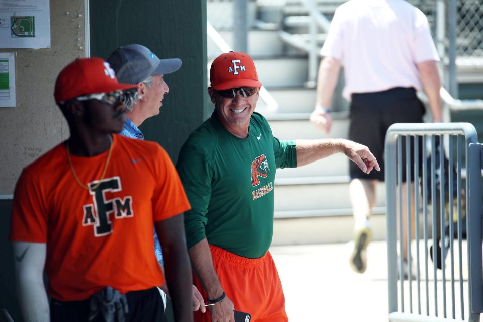 FAMU baseball head coach Jamey Shouppe shares a laugh in the dugout during practice at Georgia Tech on Thursday, May 30, 2019.