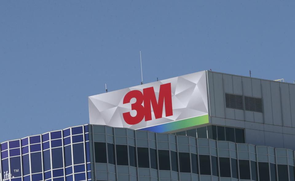 In this Aug. 29, 2019 photo, the 3M corporate logo stands atop the headquarters of the Minnesota-based company in Maplewood, Minn. (AP Photo/Jim Mone)