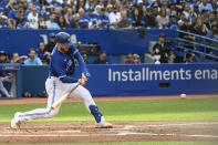 CORRECTS SURNAME TO JANSEN NOT JENSEN - Toronto Blue Jays' Danny Jansen hits a single during the second inning of a baseball game against the Boston Red Sox in Toronto on Saturday, Oct. 1, 2022. (Christopher Katsarov/The Canadian Press via AP)