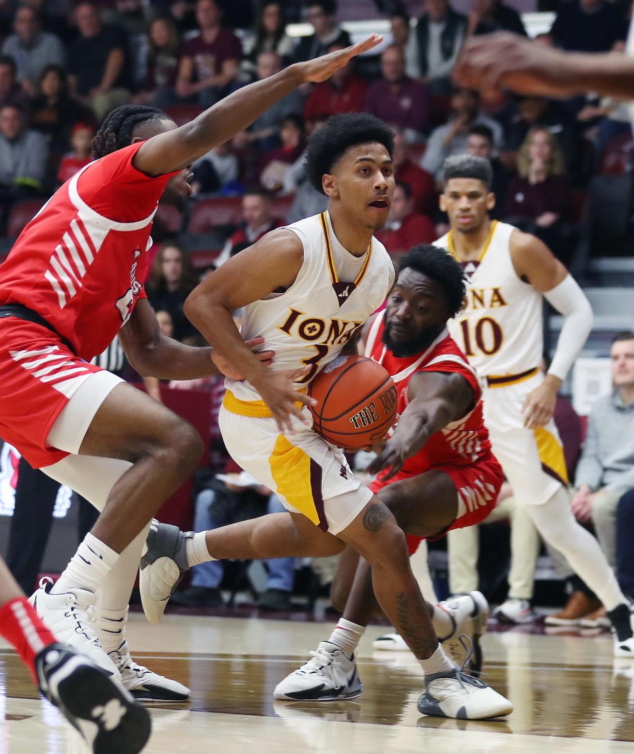 Iona's Greg Gordon (2) drives to the basket against Marist during NCAA basketball action at Hynes Center at Iona University in New Rochelle Nov. 29, 2023.