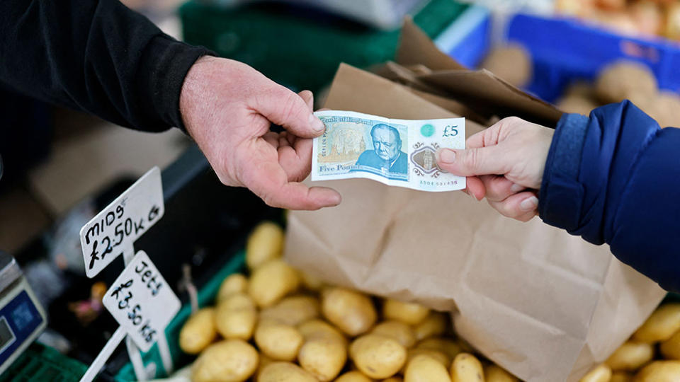 Money changing hands at Walthamstow market, November 2021