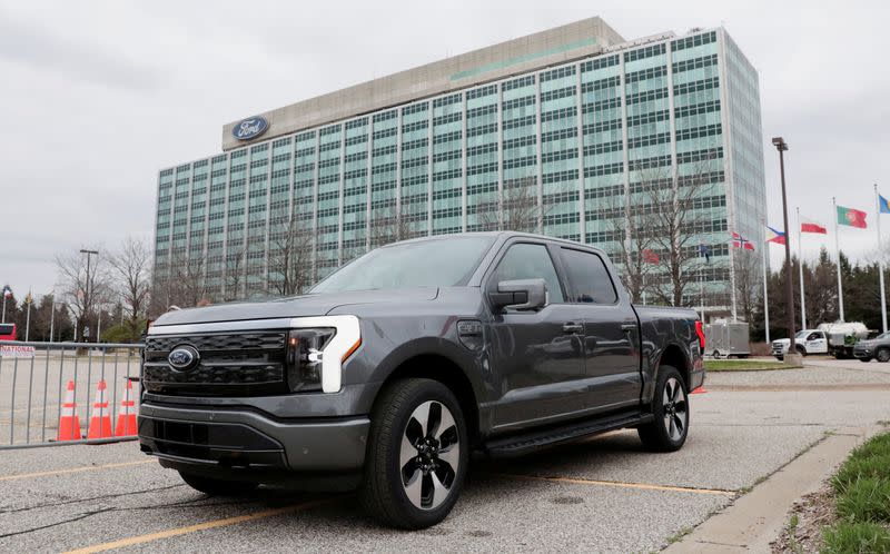 FILE PHOTO: A model of the all-new Ford F-150 Lightning electric pickup is parked in front of the Ford Motor Company World Headquarters in Dearborn