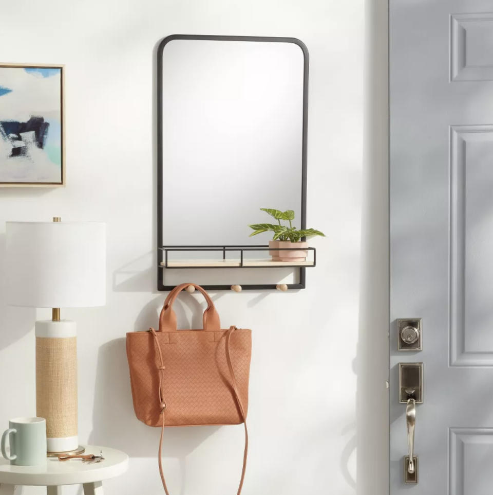 An entryway organizer with a mirror