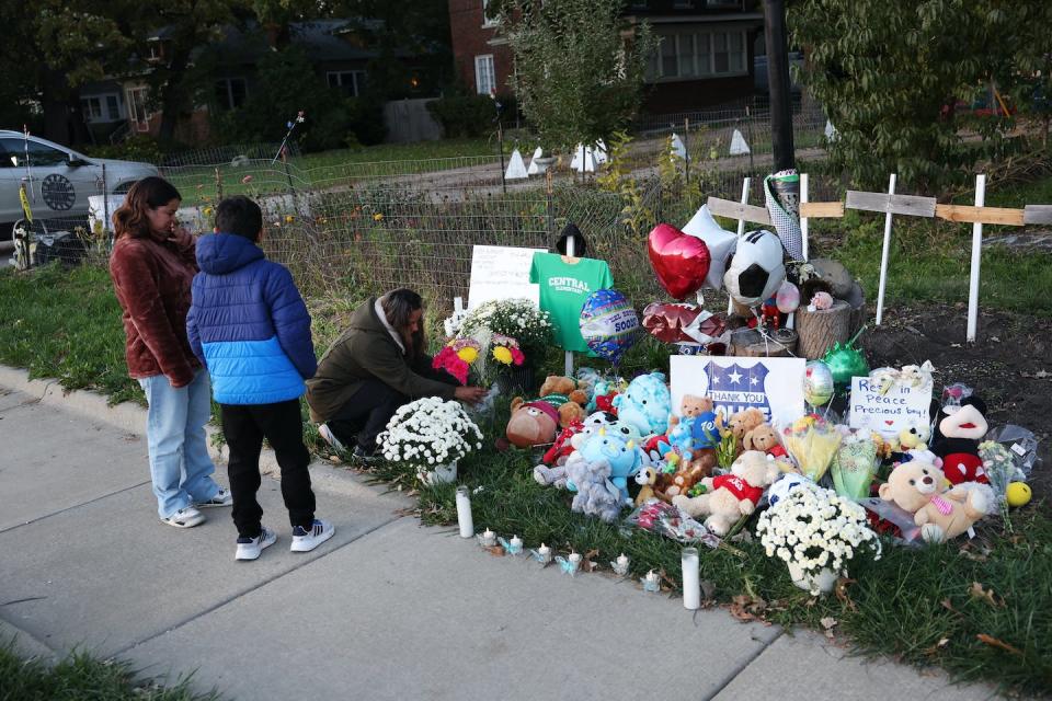 People visit a memorial for 6-year-old Palestinian American Wadea Al-Fayoume. The landlord of the building where the boy’s family lived pleaded not guilty in October 2023 to hate crime and murder charges. <a href="https://www.gettyimages.com/detail/news-photo/people-visit-a-memorial-in-front-of-the-home-where-6-year-news-photo/1741929000?adppopup=true" rel="nofollow noopener" target="_blank" data-ylk="slk:Scott Olson/Getty Images;elm:context_link;itc:0;sec:content-canvas" class="link ">Scott Olson/Getty Images</a>