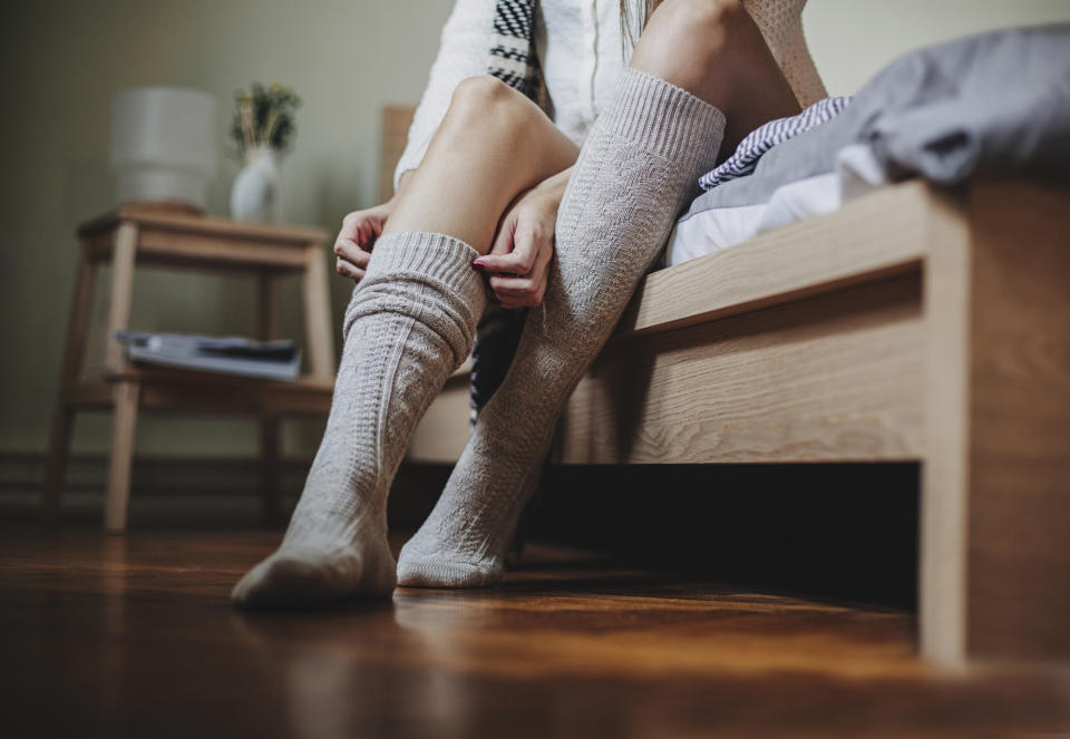 Sleep experts say wearing socks to bed could help you drift off faster. (Getty Images)