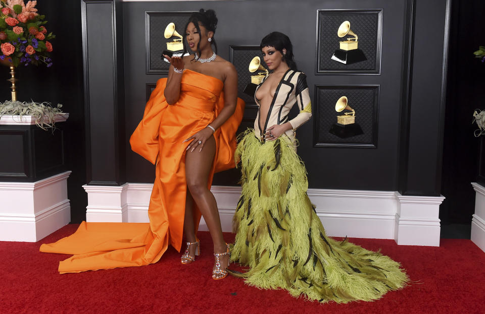 Megan Thee Stallion, left, and Doja Cat arrive at the 63rd annual Grammy Awards at the Los Angeles Convention Center on Sunday, March 14, 2021. (Photo by Jordan Strauss/Invision/AP)