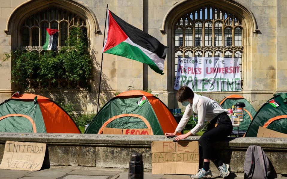 A Palestinian flag flies over the encampment at the University of Oxford