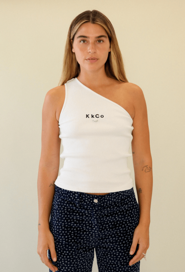 <p>KkCo Pierced One Shoulder Rib Tank in White, $80, <a href="https://www.kkcostudio.com/collections/tops/products/pierced-one-shoulder-rib-tank-in-white" rel="nofollow noopener" target="_blank" data-ylk="slk:available here;elm:context_link;itc:0;sec:content-canvas" class="link ">available here</a> (sizes XS-XL).</p>