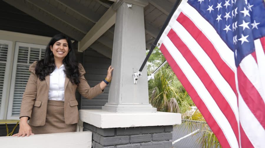 Florida state Rep. Anna Eskamani poses out front of her office Wednesday, March 27, 2024, in Orlando, Fla. For the first time in 27 years, the U.S. government is announcing changes to how it categorizes people by race and ethnicity. "It feels good to be seen," said Eskamani, whose parents are from Iran. (AP Photo/John Raoux)