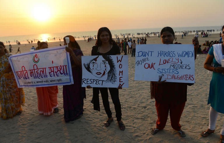 Indian members of NGO 'Aastha' hold placards during a protest in Mumbai on December 27, 2012, for better safety for women following the rape of a student in the Indian capital. An Indian gang-rape victim died Saturday, the hospital treating her in Singapore said, after suffering severe organ failure in an attack that has sparked widespread street protests