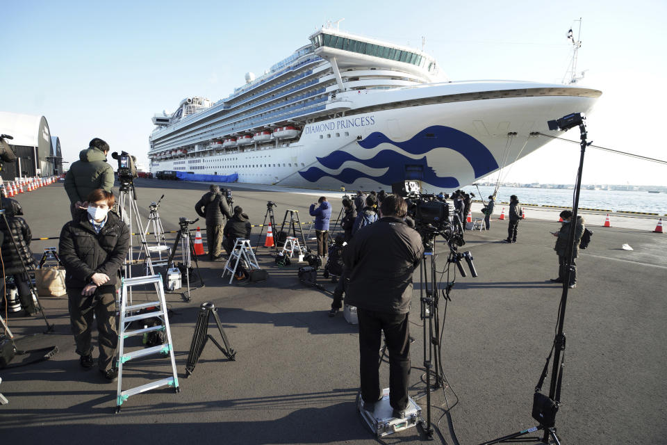 The cruise ship Diamond Princess is anchored off the Yokohama Port in Yokohama, near Tokyo Monday, Feb. 10, 2020. China reported a rise in new virus cases on Monday, possibly denting optimism disease control measures that have isolated major cities might be working, while Japan reported dozens of new cases aboard a quarantined cruise ship. (AP Photo/Eugene Hoshiko)