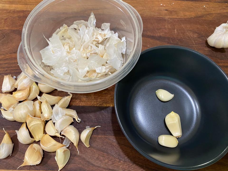 peeling 30 cloves of garlic for mashed potato recipe