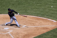 Cleveland Indians' Roberto Perez hits a three-run home run during the fourth inning of a baseball game against the Cincinnati Reds in Cincinnati, Sunday, April 18, 2021. (AP Photo/Aaron Doster)