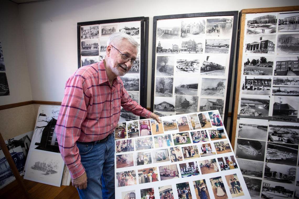 Somerset photographer David Rogers shows boards of historical photos he sells prints from his studio in Somerset, Ky., Thursday, November 9, 2022.