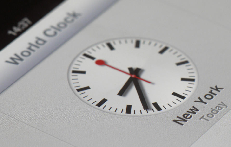 A clock symbol is displayed on an iPad with the new iOS 6 Friday, Sept.21, 2012 in Nauen, eastern Germany. Switzerland's national rail company is accusing Apple Inc. of stealing the iconic look of its station clocks for the iOS 6 operating system used by iPhone and iPad mobile devices. Both designs have a round clock face with black indicators except for the second hand which is red. (AP Photo/Ferdinand Ostrop)