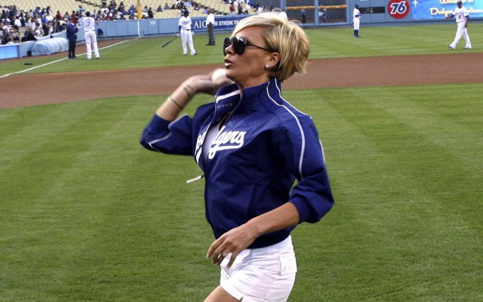 Victoria Beckham throws out the first pitch at a Los Angeles Dodgers vs New York Mets game in 2007 - Jon Soohoo/WireImage