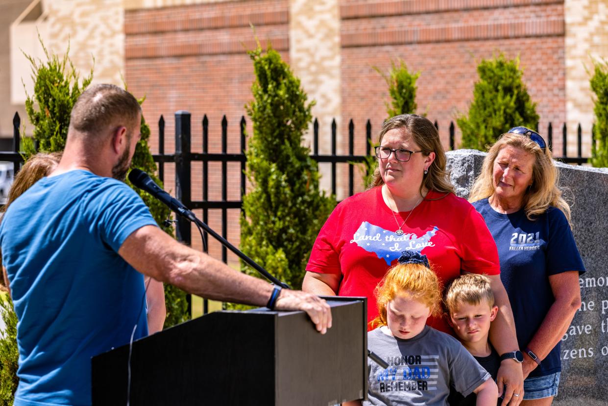 Ten-Seven Retreat co-founders Dwight and Shelley L. Durant tell the Davis family about their all-expenses-paid trip to the Exuma Islands on Friday outside the Bartlesville Public Safety Complex.