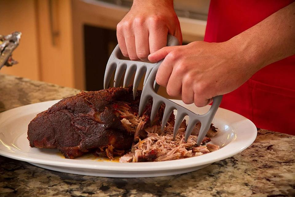 You won't have to suffer from burned fingertips while trying to get closer to flawlessly replicating your grandma's famous pulled-pork recipe.<br /><br /><strong>Promising review:</strong> "Works well for shredding larger portions of meat, like pork. Plastic appears to be of higher quality. Sufficient room in the opening for most finger and hand sizes. The pointed tips shouldn't cause injury unless you're careless. I'd highly recommend the use of quality protective gloves; you're not only dealing with the mess of shredding itself but also, most likely, some elevated temperature food." &mdash; <a href="https://amzn.to/3gyg8rt" target="_blank" rel="noopener noreferrer">Legardi11</a><br /><br /><strong>Get it from Amazon for <a href="https://amzn.to/32EKy31" target="_blank" rel="noopener noreferrer">$12.95+</a> (available in four colors).</strong>