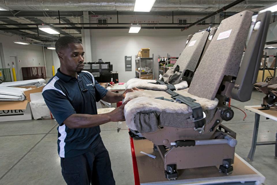 Antwonn Williams works in the interior maintenance shop at ST Engineering on Oct. 14. ST Engineering has hired just over 200 employees, reaching the halfway mark for the 400 new jobs that its first hangar promised to deliver.