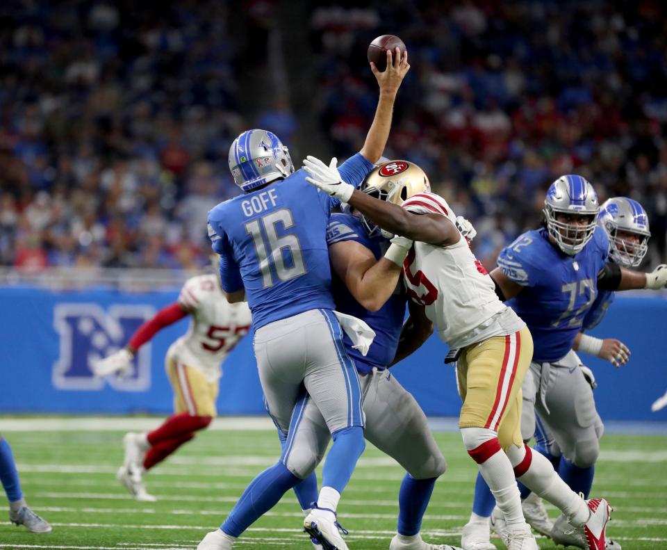 Detroit Lions quarterback Jared Goff is hit by San Francisco 49ers linebacker Dee Ford causing him to throw an interception returned for a touchdown Sunday, September 12, 2021 at Ford Field.