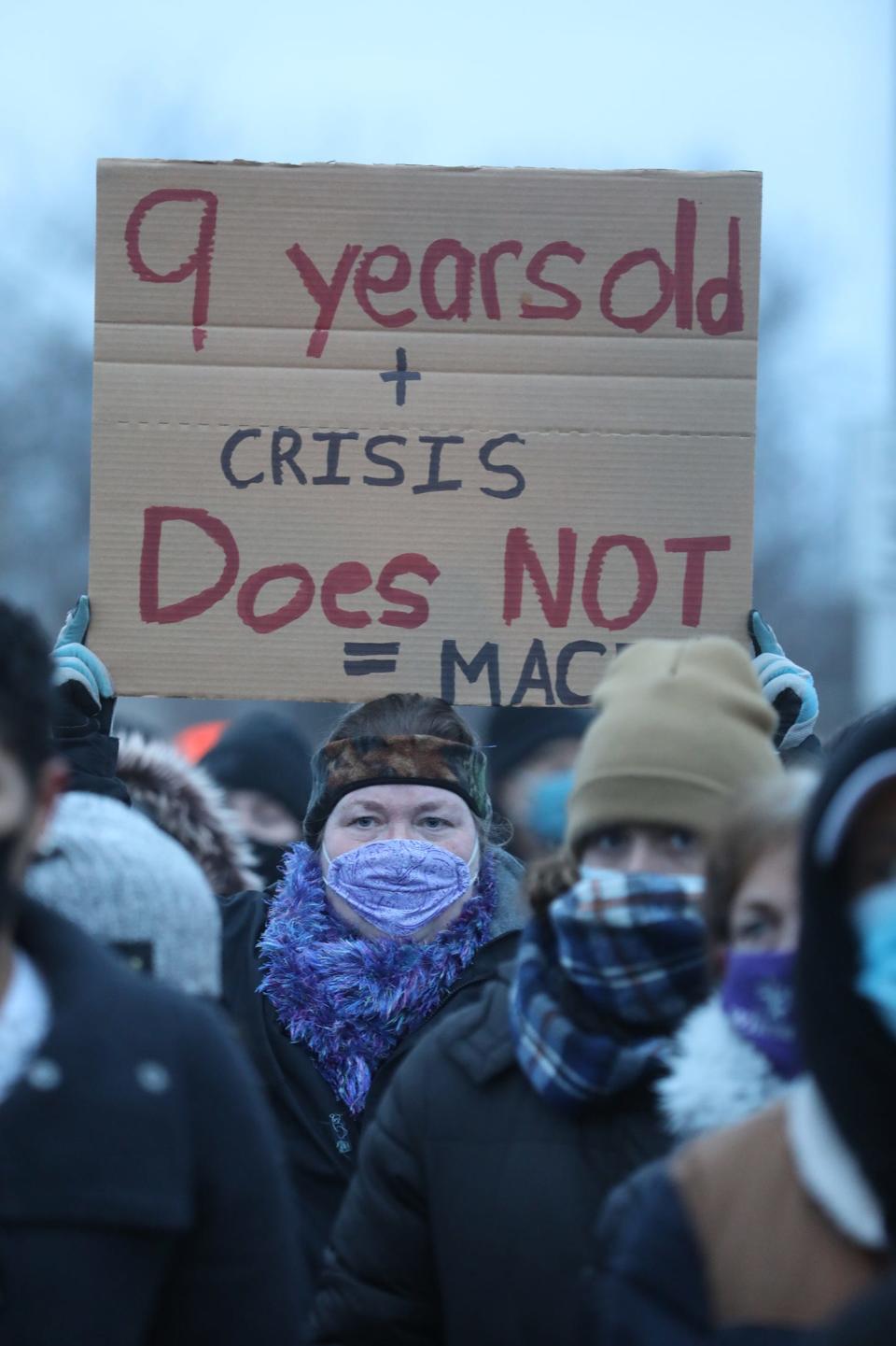 Members of Community Justice Initiative along with supporters marched Feb. 1, 2021 from N. Clinton Avenue and Ave. D in Rochester, NY to the Rochester Police Department's Clinton Section at N. Clinton Ave. and Upper Falls Boulevard to protest the police handcuffing and using pepper spray on a 9-year-old girl.