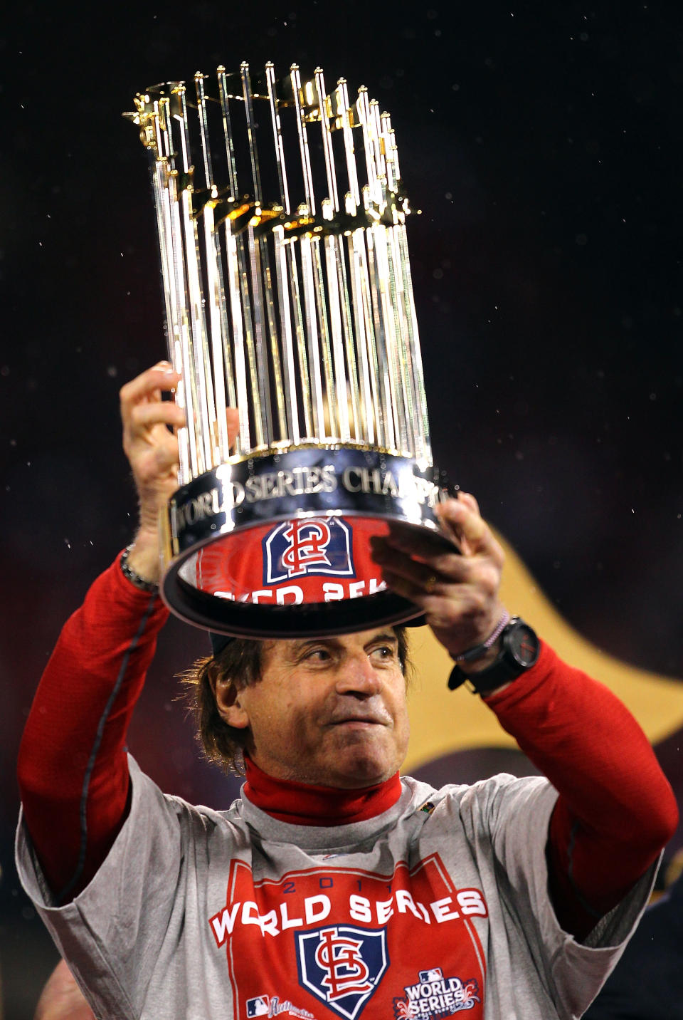 ST LOUIS, MO - OCTOBER 28: Manager Tony La Russa holds up the World Series trophy after defeating the Texas Rangers 6-2 in Game Seven of the MLB World Series at Busch Stadium on October 28, 2011 in St Louis, Missouri. (Photo by Dilip Vishwanat/Getty Images)