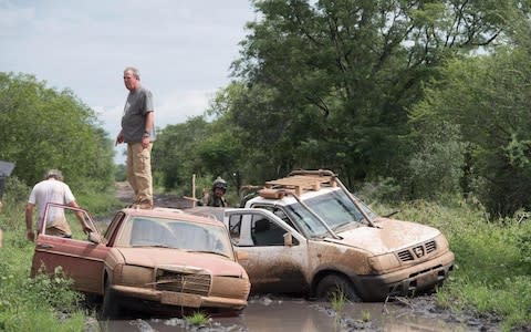 Jeremy Clarkson trying to keep his feet dry in Mozambique - Credit: Amazon Prime Video