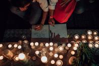 <p>People in Hong Kong take part in a candlelight vigil for the victims of the Orlando massacre, June 13, 2016, in Hong Kong. The vigil was organized by Betty Grisoni, co-director of Pink Dot and co-founder of local lesbian group Les Peches. (Anthony Kwan/Getty Images) </p>