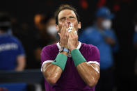 Rafael Nadal of Spain celebrates after defeating Matteo Berrettini of Italy in their semifinal match at the Australian Open tennis championships in Melbourne, Australia, Friday, Jan. 28, 2022.(AP Photo/Andy Brownbill)