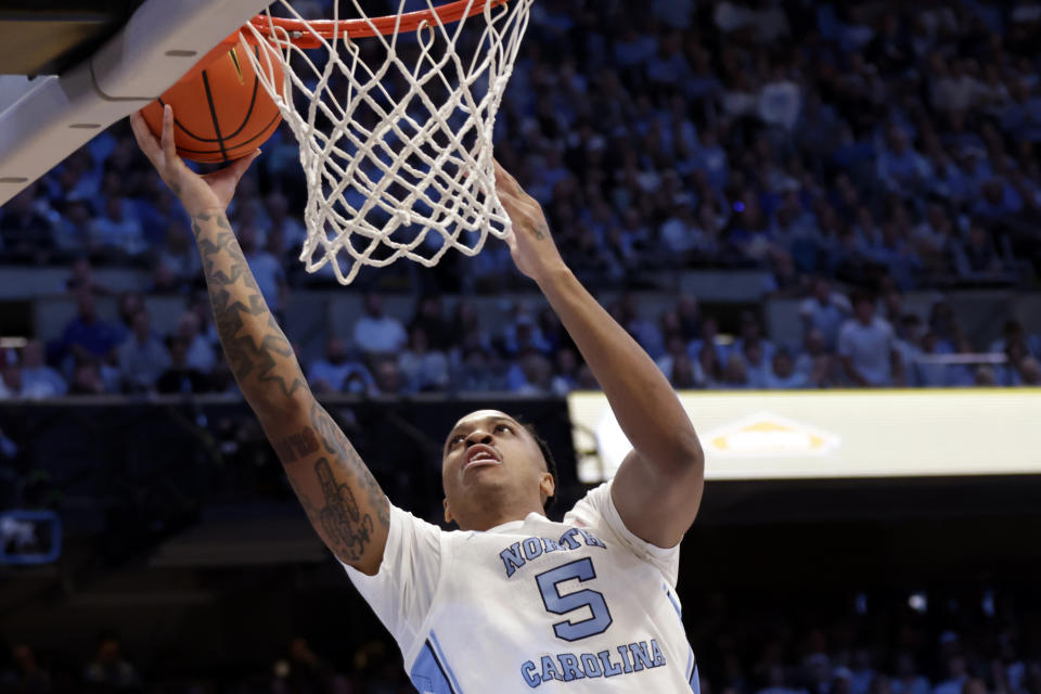 North Carolina forward Armando Bacot (5) goes in for a layup against Duke during the first half of an NCAA college basketball game Saturday, Feb. 3, 2024, in Chapel Hill, N.C. (AP Photo/Chris Seward)