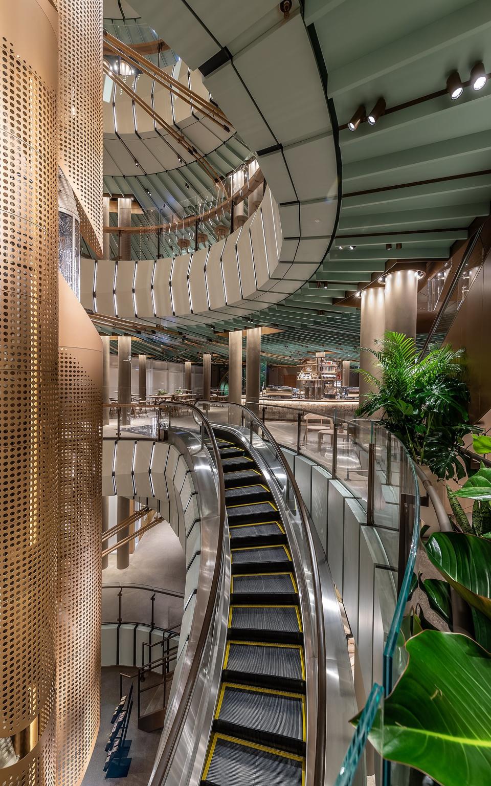 To get from the first to second floors, hop on the Midwest's first spiral escalator, which circles the cask. The layout of the store was inspired in part by the former Crate & Barrel; Starbucks designers kept the original facade of the historic building, using its natural light and Scandinavian tinge for the tan and green shades throughout the space.