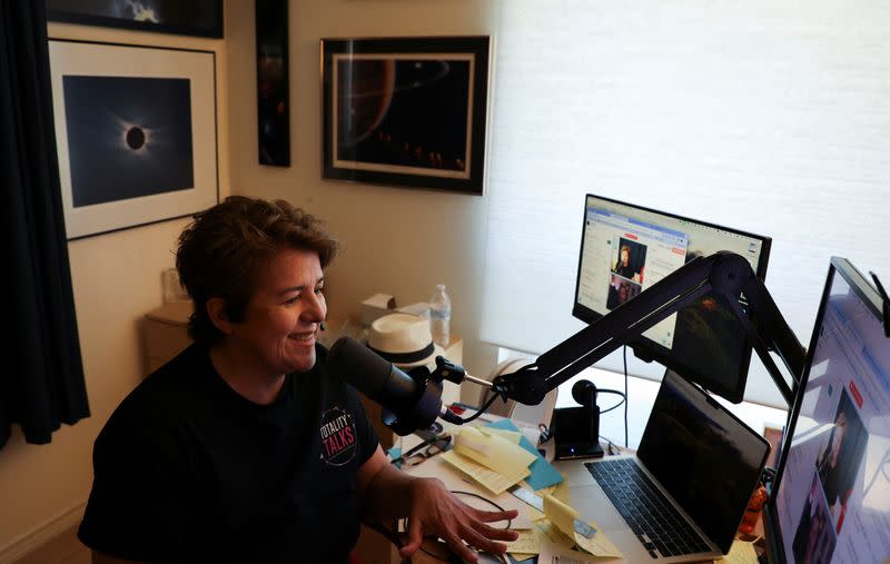 Eclipse chaser Leticia Ferrer conducts a podcast interview regarding the upcoming April 8, 2024 total solar eclipse, at her home in Dallas