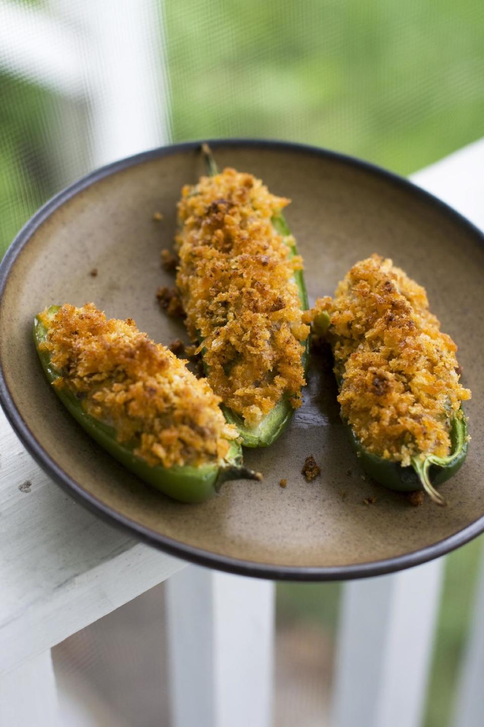 In this image taken on May 20, 2013, cheesy sausage-stuffed jalapeno peppers are displayed in Concord, N.H. (AP Photo/Matthew Mead)