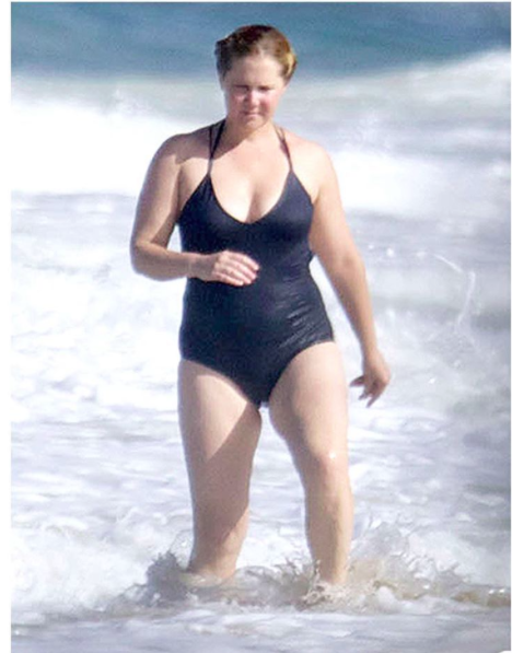<p>Just when we thought we couldn’t love Amy Schumer more, she goes and socks it to body shaming trolls, like only she knows how. When pictures of her wearing a swimsuit on holiday started doing the Internet rounds and the haters started inevitably populating the comments, she hit back in the best way. Taking to Instagram to repost one of the paparazzi shots, she wrote: “I meant to write ‘good morning trolls!’ I hope you find some joy in your lives today in a human interaction and not just in writing unkind things to a stranger you’ve never met who triggers something in you that makes you feel powerless and alone. This is how I look. I feel happy.” She went on to jokingly referring to one particular troll who compared her to a character from the film Matilda. “I think I look strong and healthy and also like miss trunchbull from Matilda. Kisses!” Kisses back atcha Amy. <i>[Photo: Instagram/Amyschumer]</i></p>