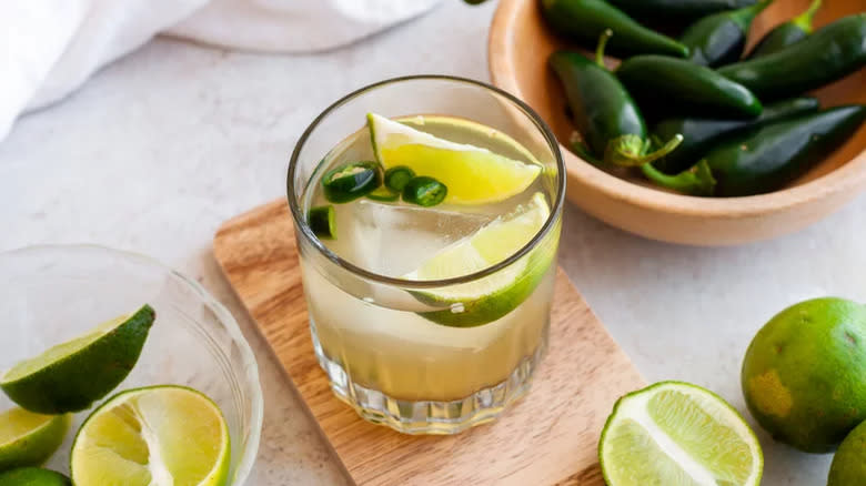 Cocktail with lime and jalapeños