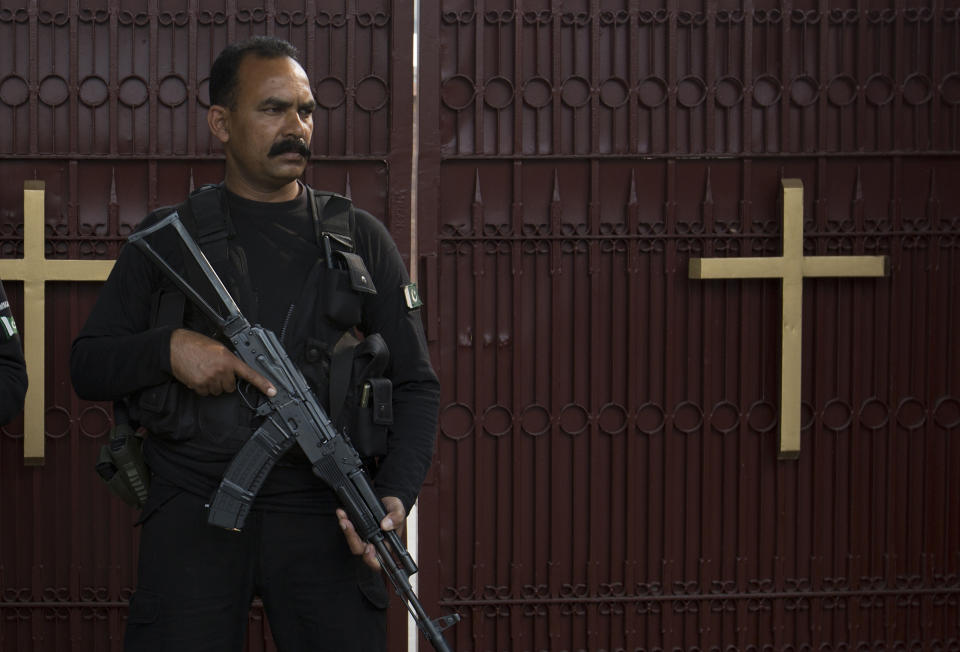 In this Oct. 31, 2018, photo, a Pakistani police commando stands guard outside St. Thomas' church in Islamabad, Pakistan, Oct. 31, 2018. The uproar surrounding Aasia Bibi _ a Pakistani Christian woman who was acquitted of blasphemy charges and released from death row but remains in isolation for her protection _ has drawn attention to the plight of the country's Christians.The minority, among Pakistan's poorest, has faced an increasingly intolerant atmosphere in this Muslim-majority nation where radical religious and sectarian groups have become more prominent in recent years. (AP Photo/B.K. Bangash)