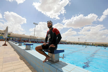 Egyptian swimmer Omar Hegazy, who is the first one-legged man to swim across the Gulf of Aqaba from Egypt to Jordan, rests after practice in Cairo, Egypt May 20, 2017. Picture taken May 20, 2017. REUTERS/Mohamed Abd El Ghany