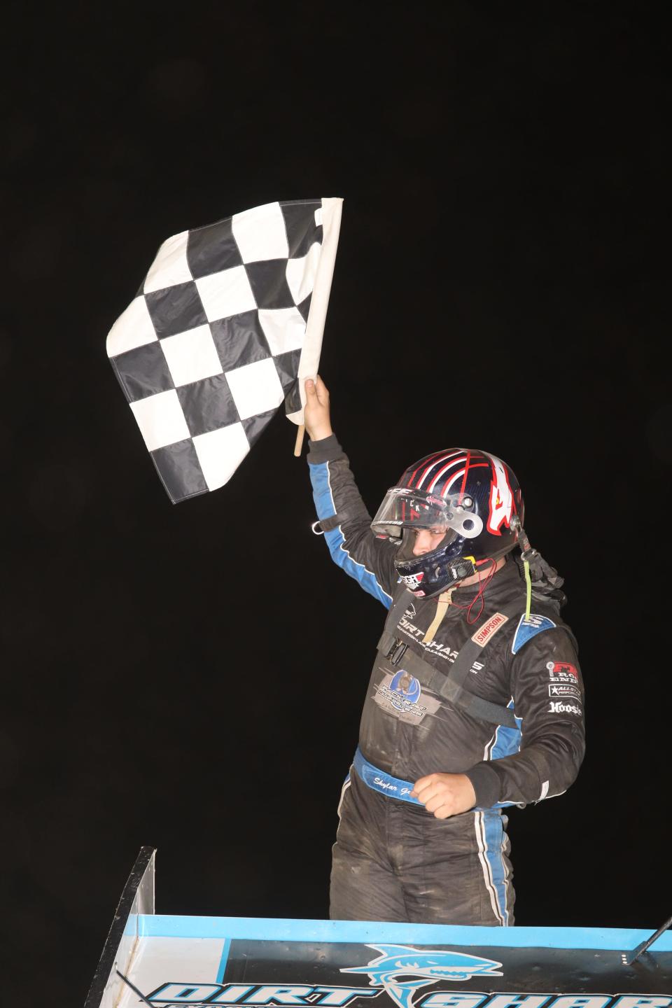 Skylar Gee celebrates in victory lane after winning at Fremont Speedway.