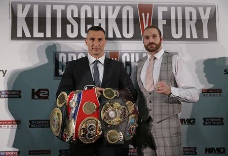 Boxing - Wladimir Klitschko & Tyson Fury Head-to-Head Press Conference - Hilton Syon Park, Brentford, Middlesex - 23/9/15 Wladimir Klitschko and Tyson Fury (R) pose after the press conference Action Images via Reuters / Andrew Couldridge Livepic