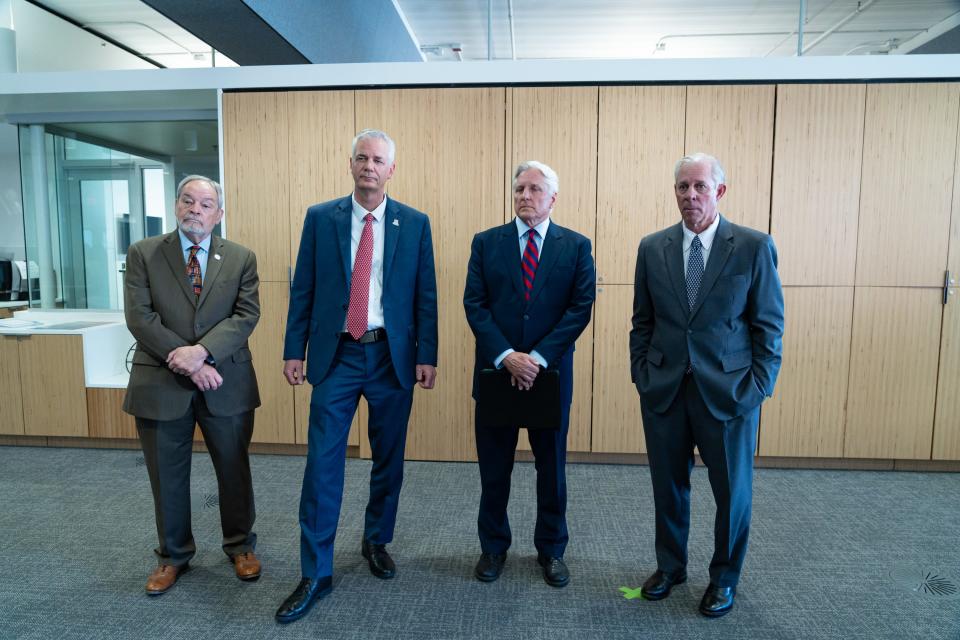 Interim Senior Vice President for Academic Affairs and Provost, Dr. Ronald Marx (left), University of Arizona interim CFO John Arnold (second from left), AZ Board of Regents Chair Fred DuVal (second from right), and UA President Robert Robbins take questions from reporters after a leadership meeting concerning finances in the university's Health Sciences Innovation Building on Jan. 29, 2024, in Tucson, Ariz.