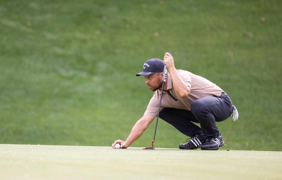 Xander Schauffele lines up his putt on the 8th hole round one of the Wells Fargo Championship at Quail Hollow Club in Charlotte, N.C., on Thursday, May 9, 2024.