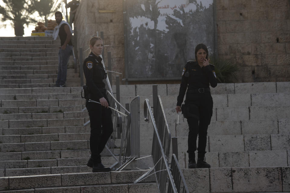 Israeli police fortify fencing leading to the Damascus Gate to the Old City of Jerusalem, as worshippers arrive to break their fast and take part in the evening prayer for the Muslim holy month of Ramadan, Saturday, April 24, 2021. Protesters and police have clashed nightly during Ramadan at this site. (AP Photo/Maya Alleruzzo)