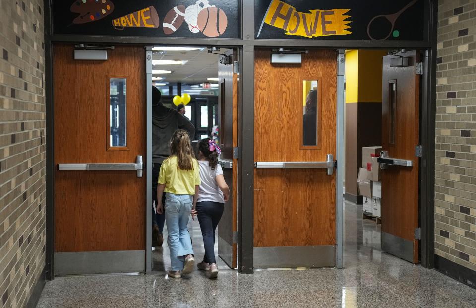 Future students and parents walk through the school Wednesday, Nov. 1, 2023, at T.C. Howe Middle School in Indianapolis.