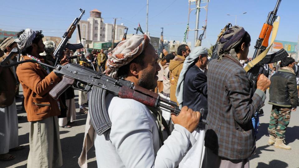 PHOTO: Newly recruited Houthi fighters hold up firearms during a ceremony at the end of their training in Sanaa, Yemen, Jan. 11, 2024.  (Khaled Abdullah/Reuters)